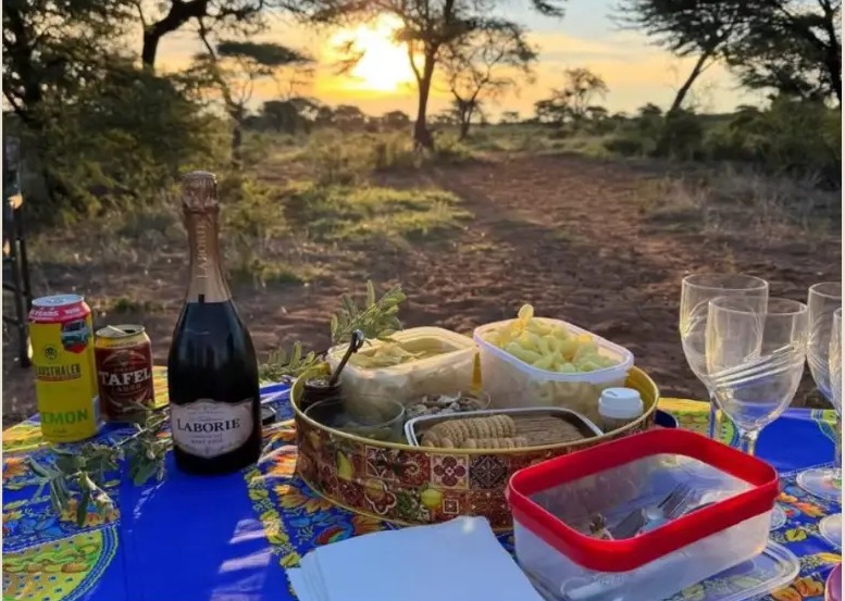 A bush picnic laid out at sunset